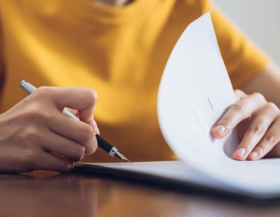 Woman signing document