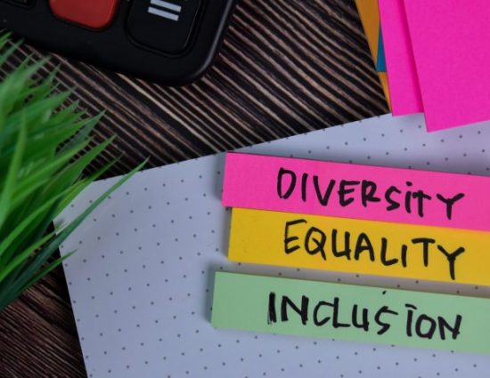 Diversity Equality Inclusion write on a sticky note isolated on Office Desk.