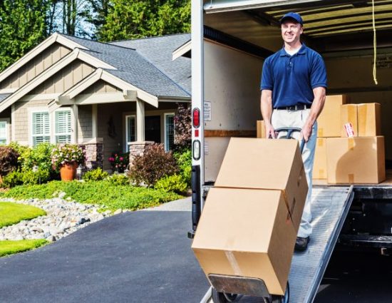 Photo of a delivery man unloading (or loading) truck