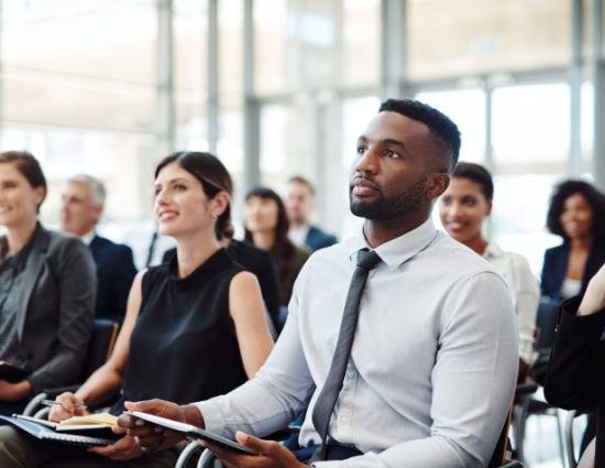 Shot of a group of businesspeople attending a conference