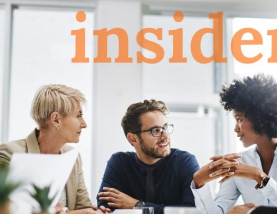 Team meeting around table with the word insider