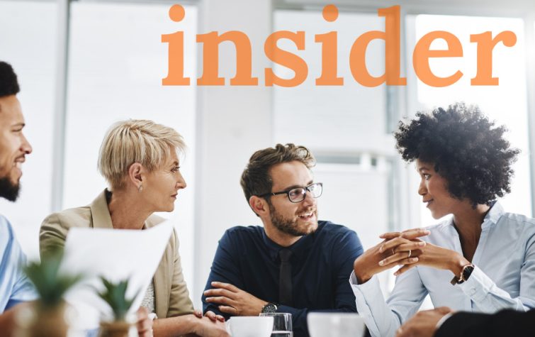 Team meeting around table with the word insider