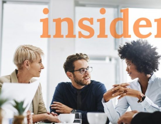 Team meeting around table with the word insider