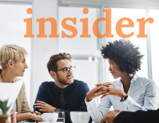 Team meeting around table with the word insider