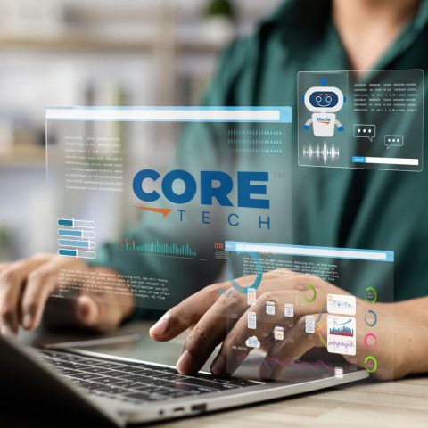 Person working on a laptop with futuristic AI dashboards, data visualizations, and the CoreTech™ logo representing intelligent, secure relocation technology.